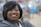 woman in gray hoodie smiling