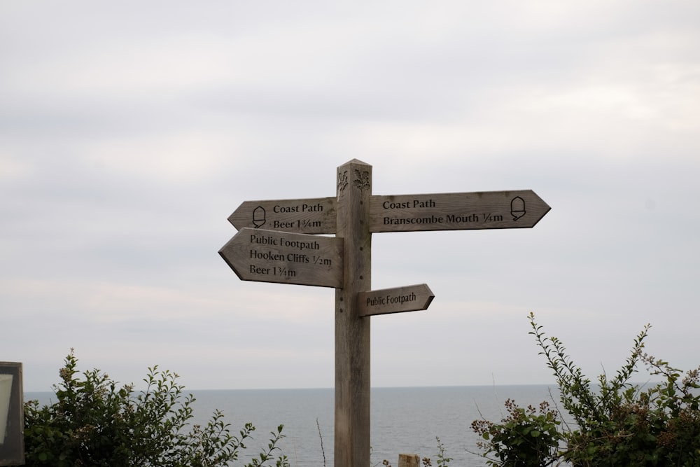 white and black wooden signage