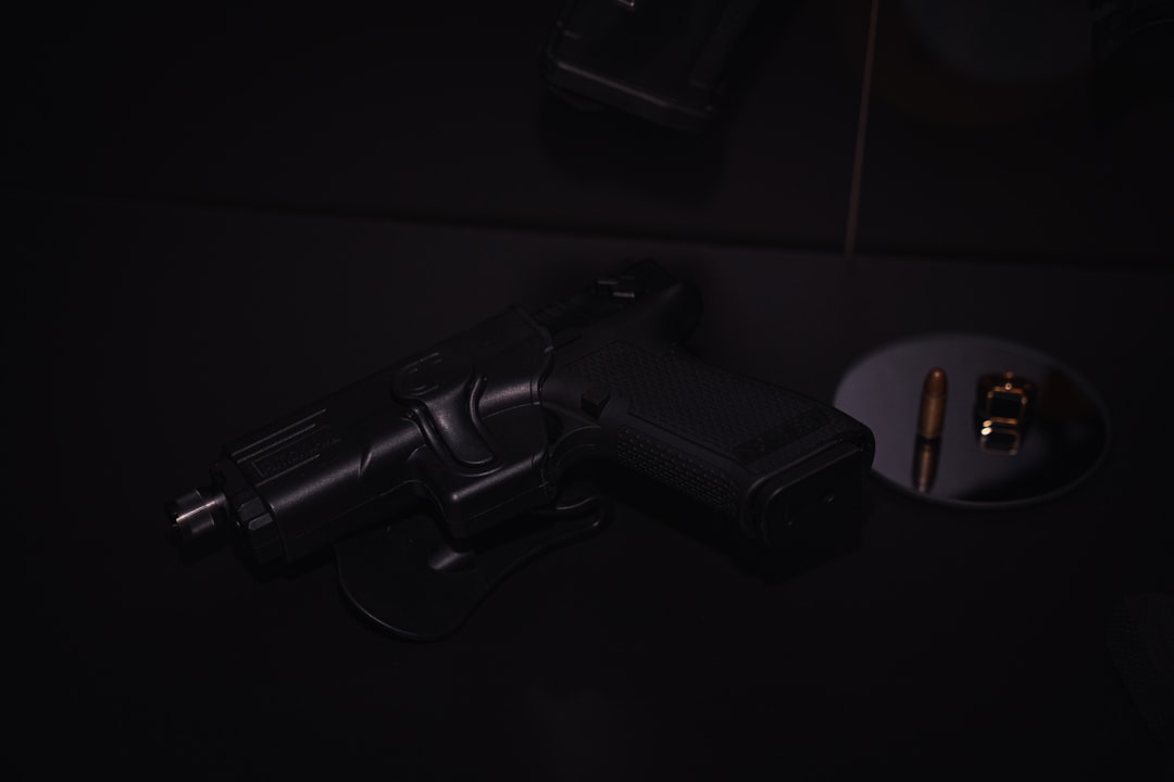 black semi automatic pistol on black surface