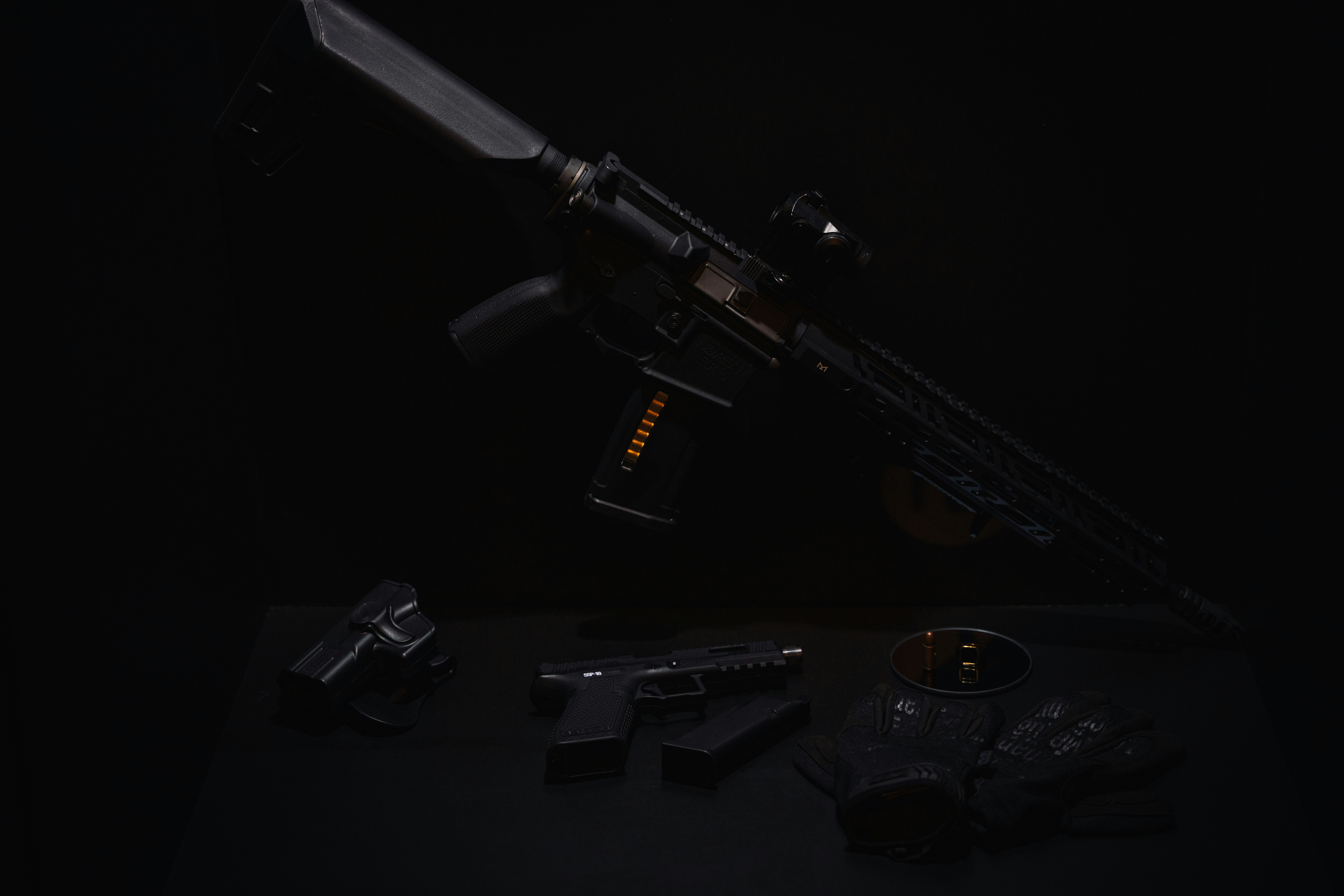 black and gray rifle with scope