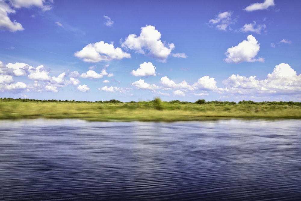 blue sky and white clouds over the lake