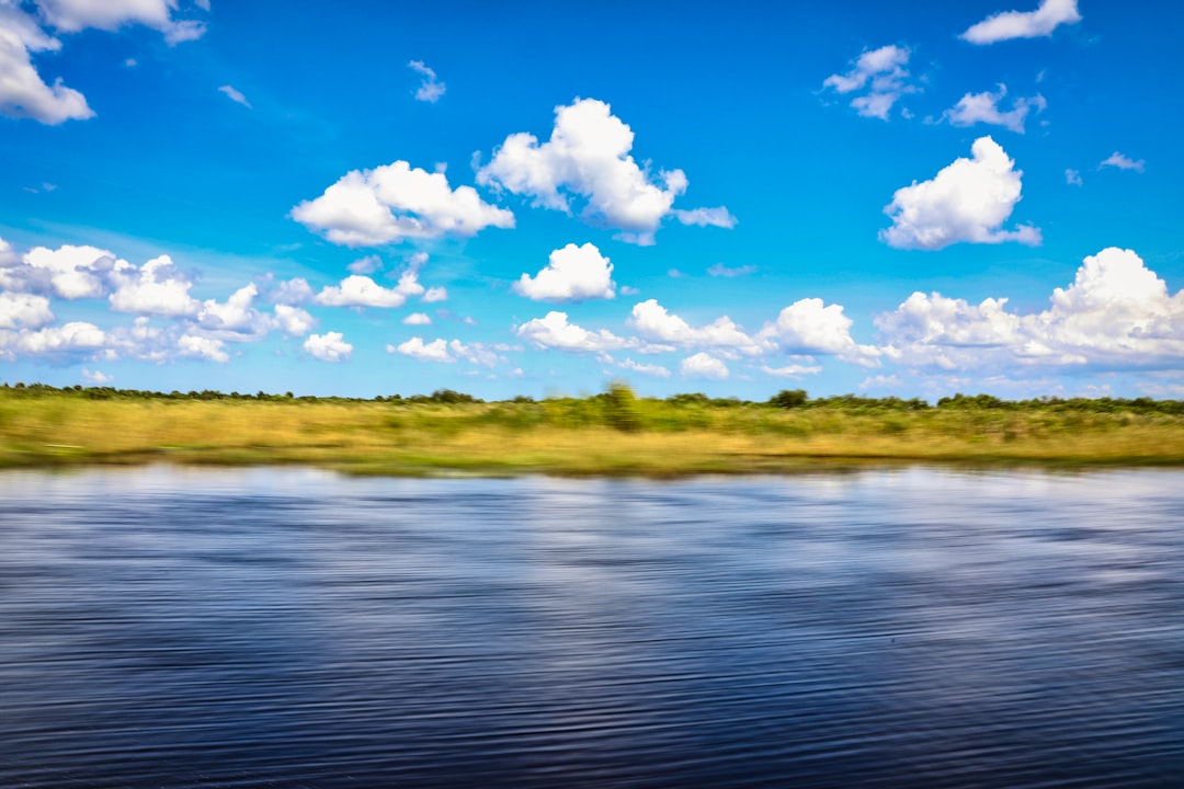 blue sky and white clouds over the lake