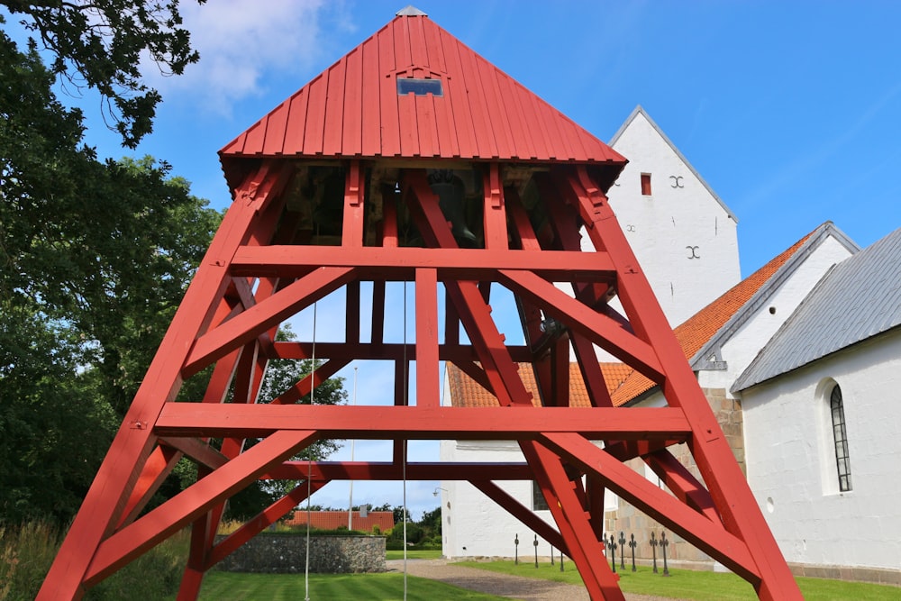 brown wooden building near green trees during daytime