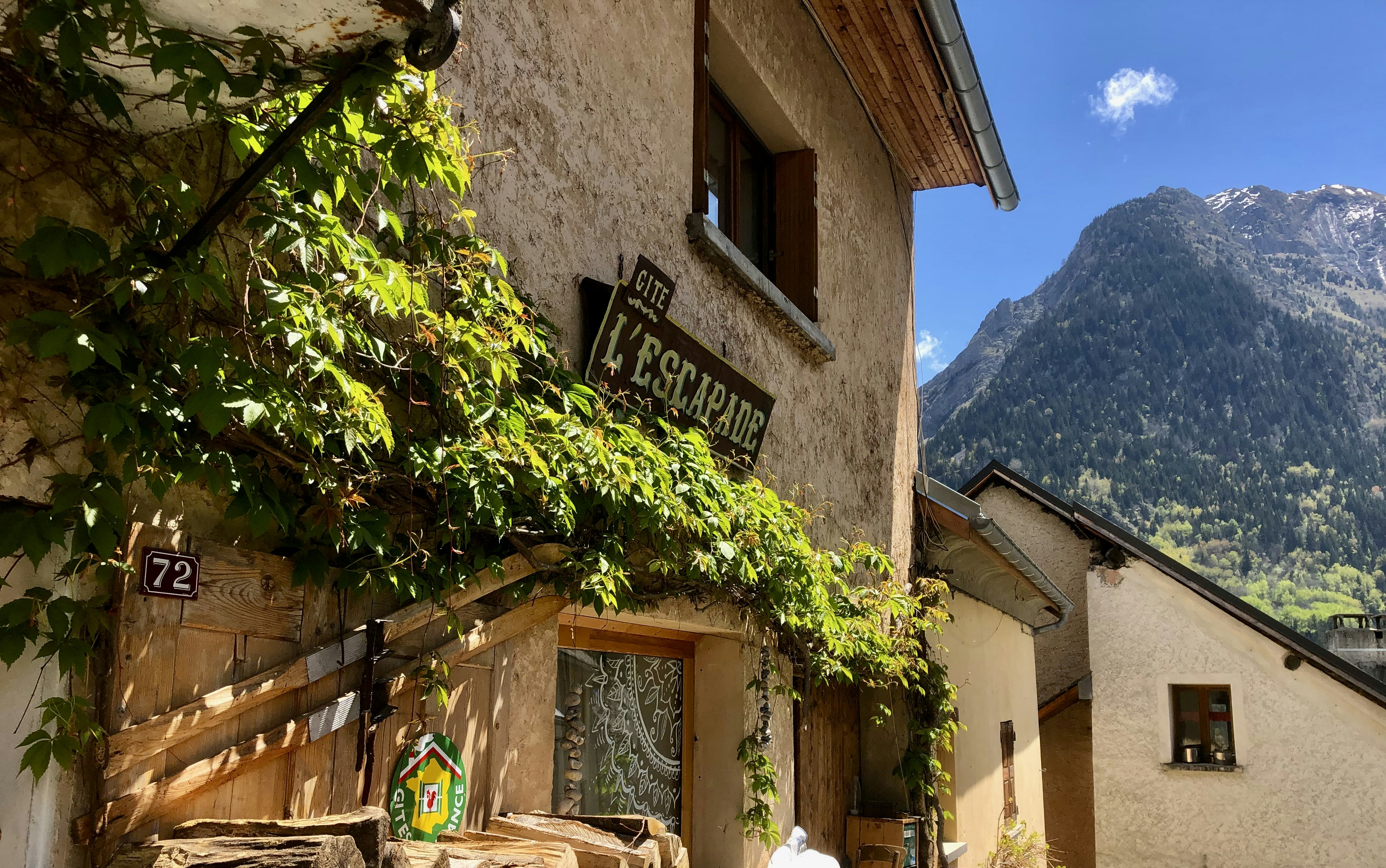 brown wooden signage on brown concrete building during daytime