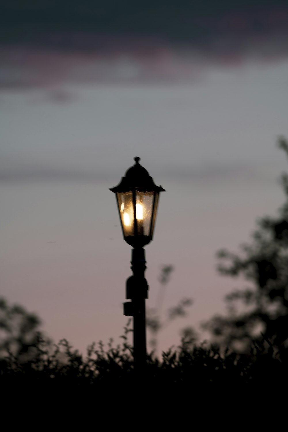 black street lamp during daytime