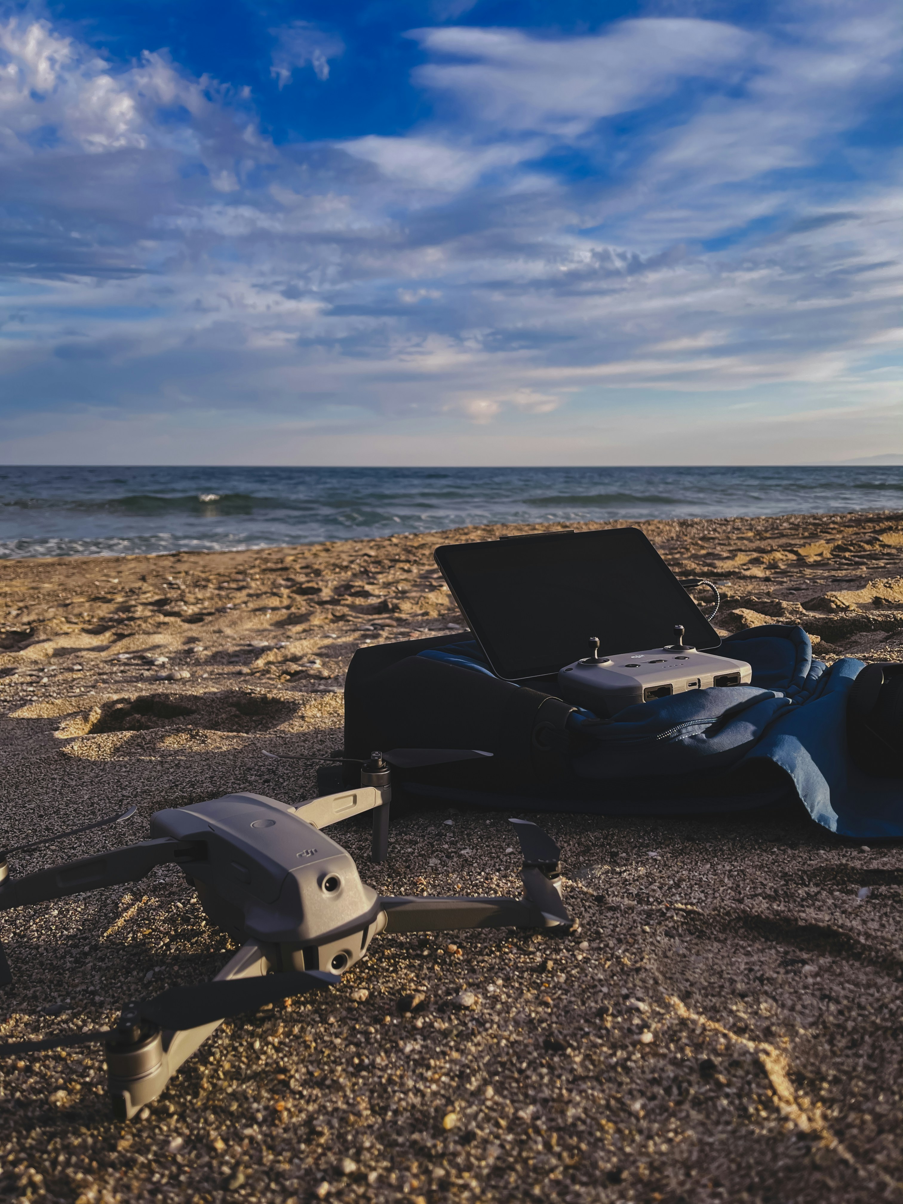 white and black sports bike on brown sand during daytime