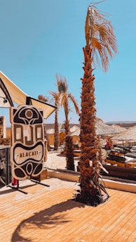Guests enjoying a sunny terrace overlooking the vibrant town of Çeşme.