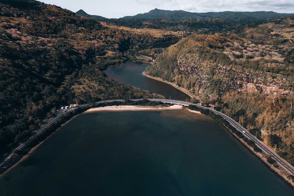 aerial view of river between mountains during daytime