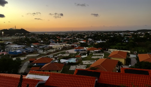 Sunset view of a residential area developed on a macrolot with green spaces