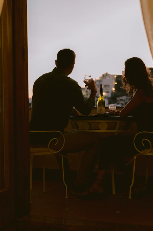 Wedding couple at sunset dinner table