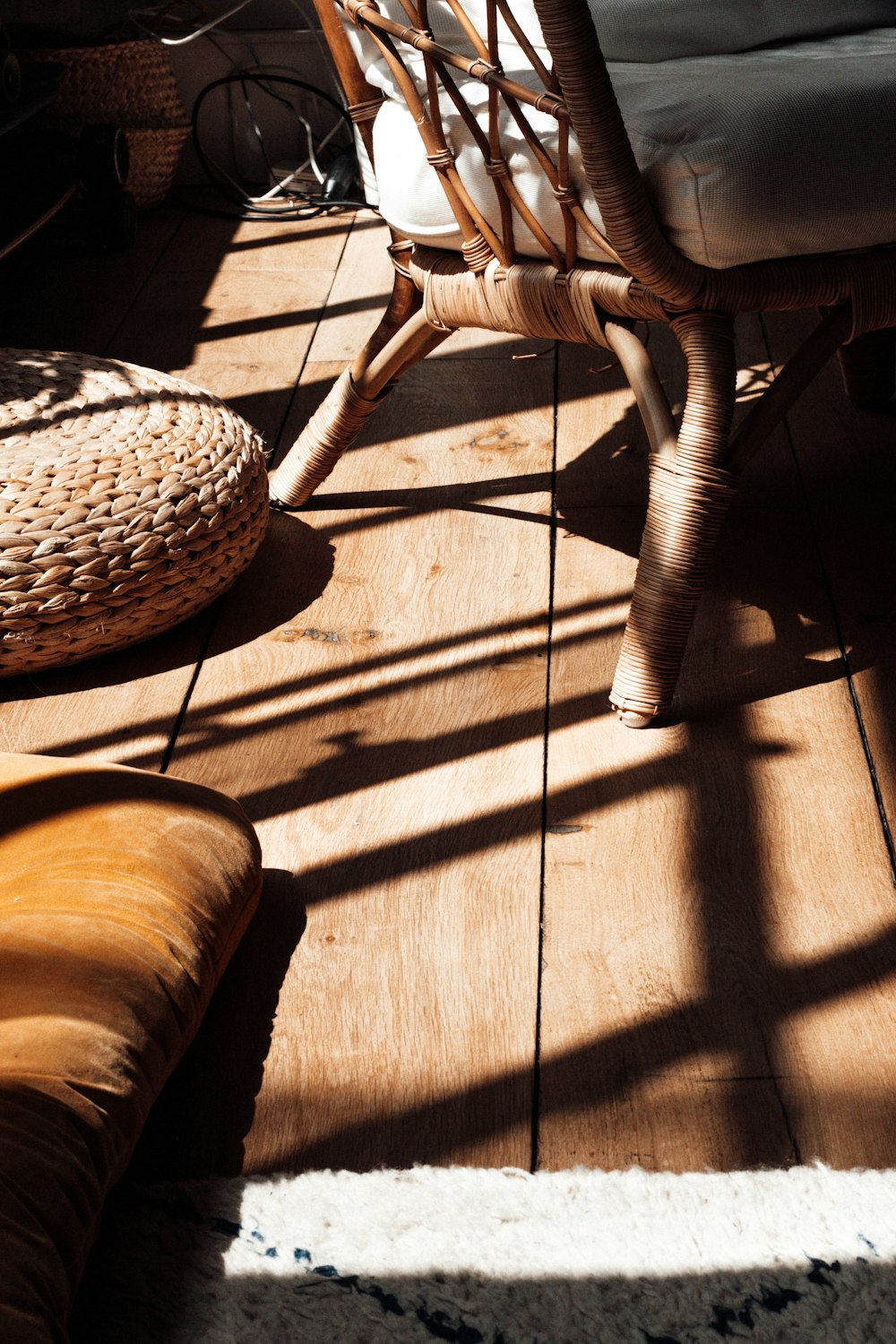 brown wicker round chair on brown wooden floor