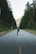 A satisfied customer enjoying a scenic ride on a longboard.