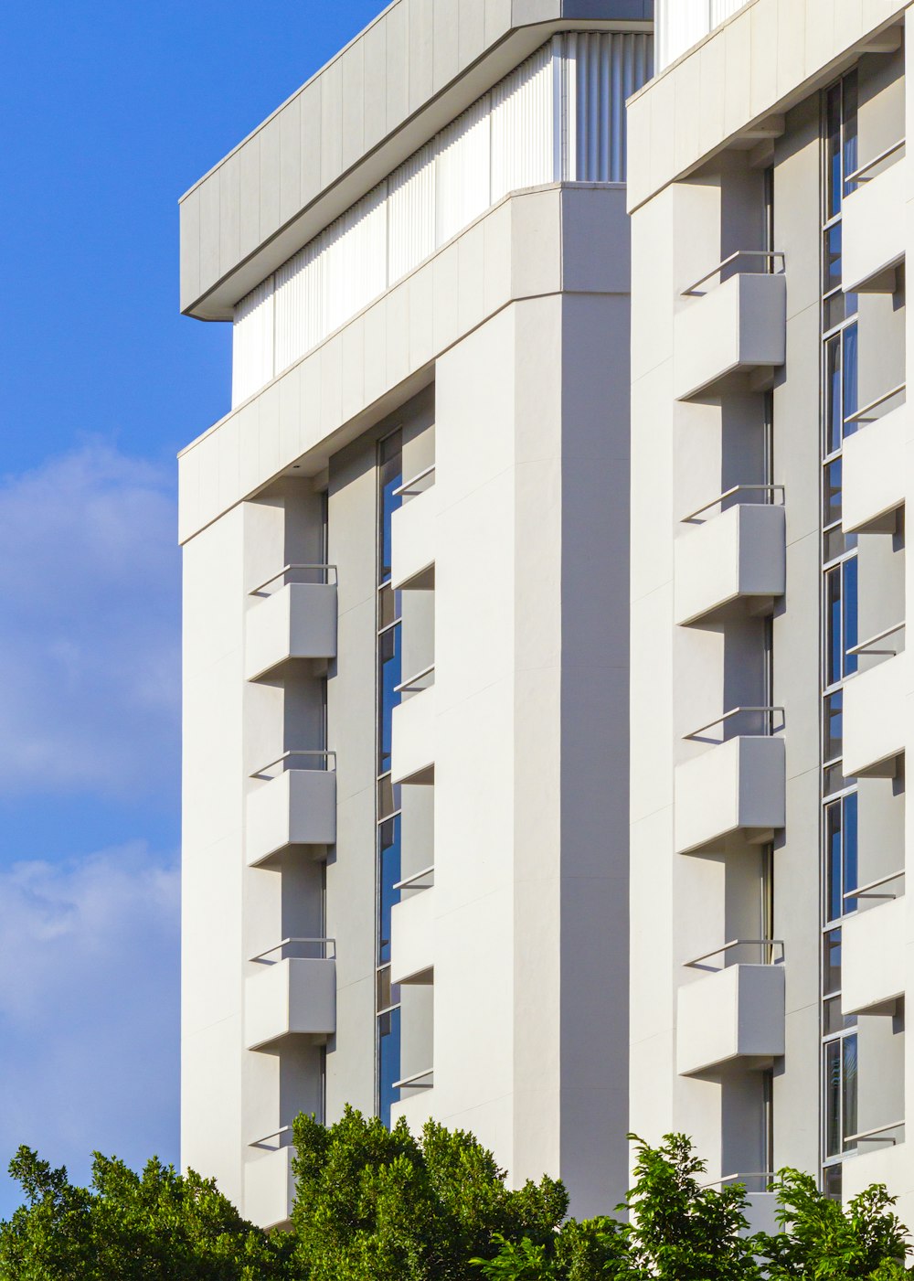 white concrete building under blue sky during daytime