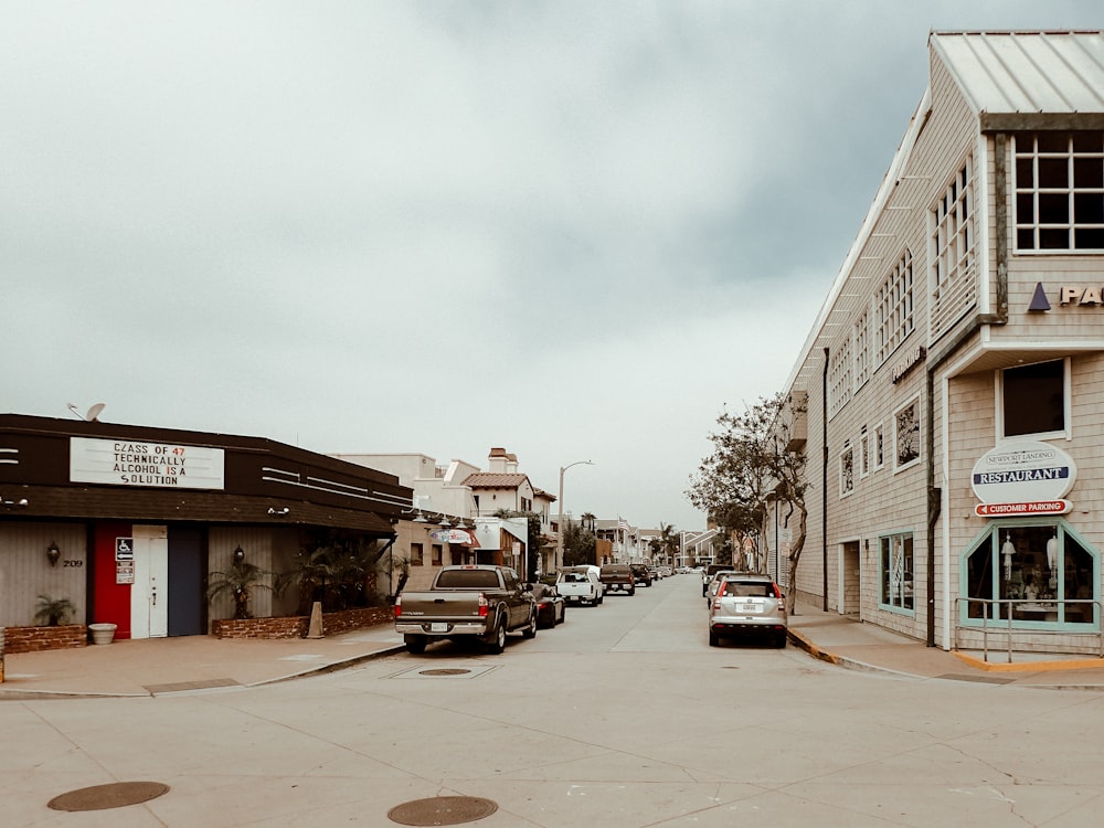 cars parked in front of building during daytime