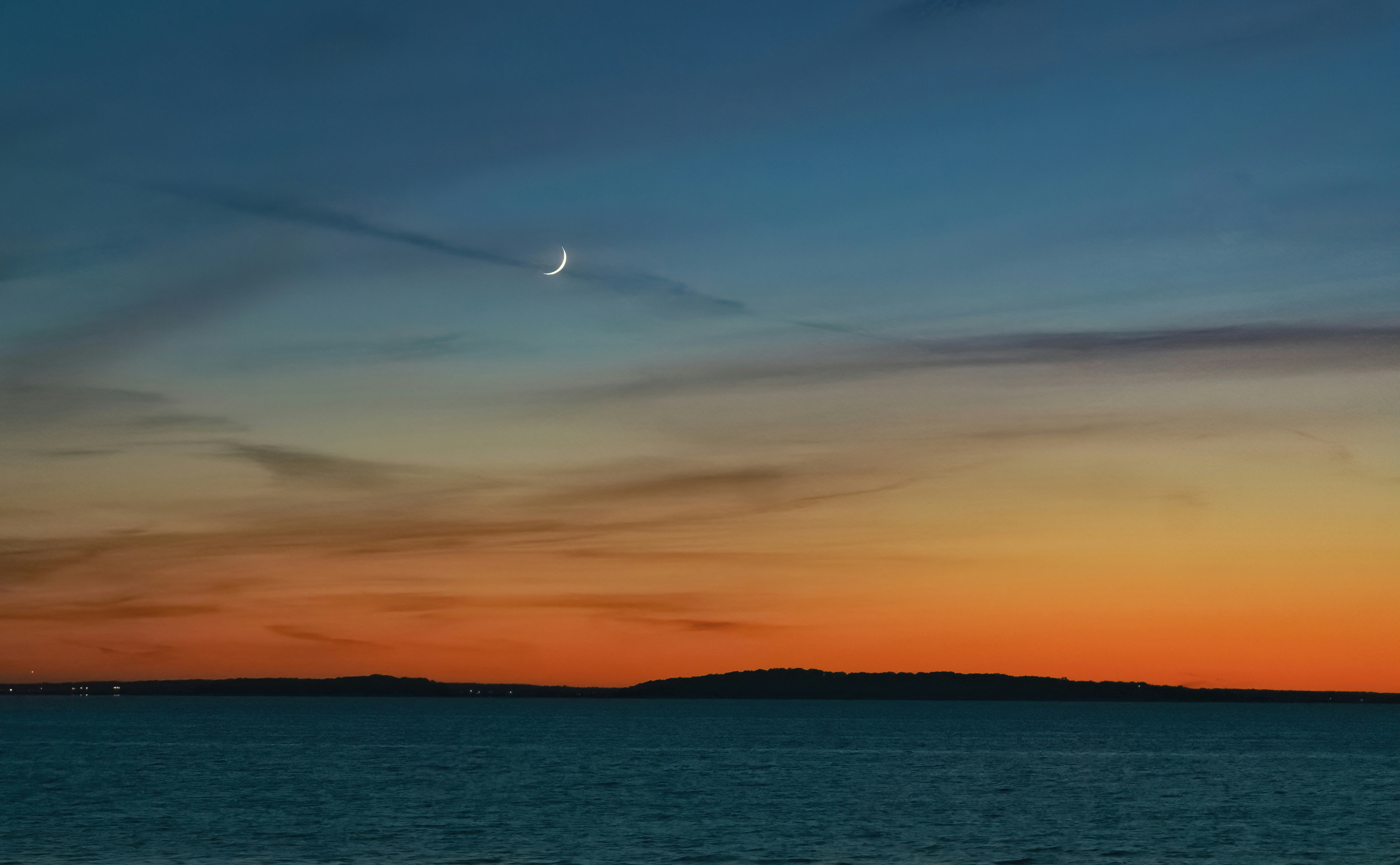 body of water during sunset