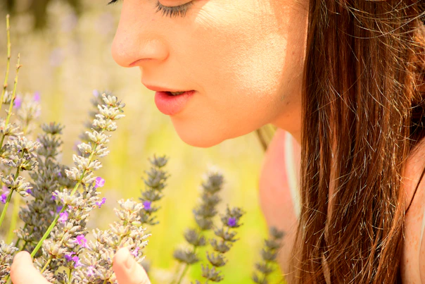 woman in yellow shirt with purple flowers on her head