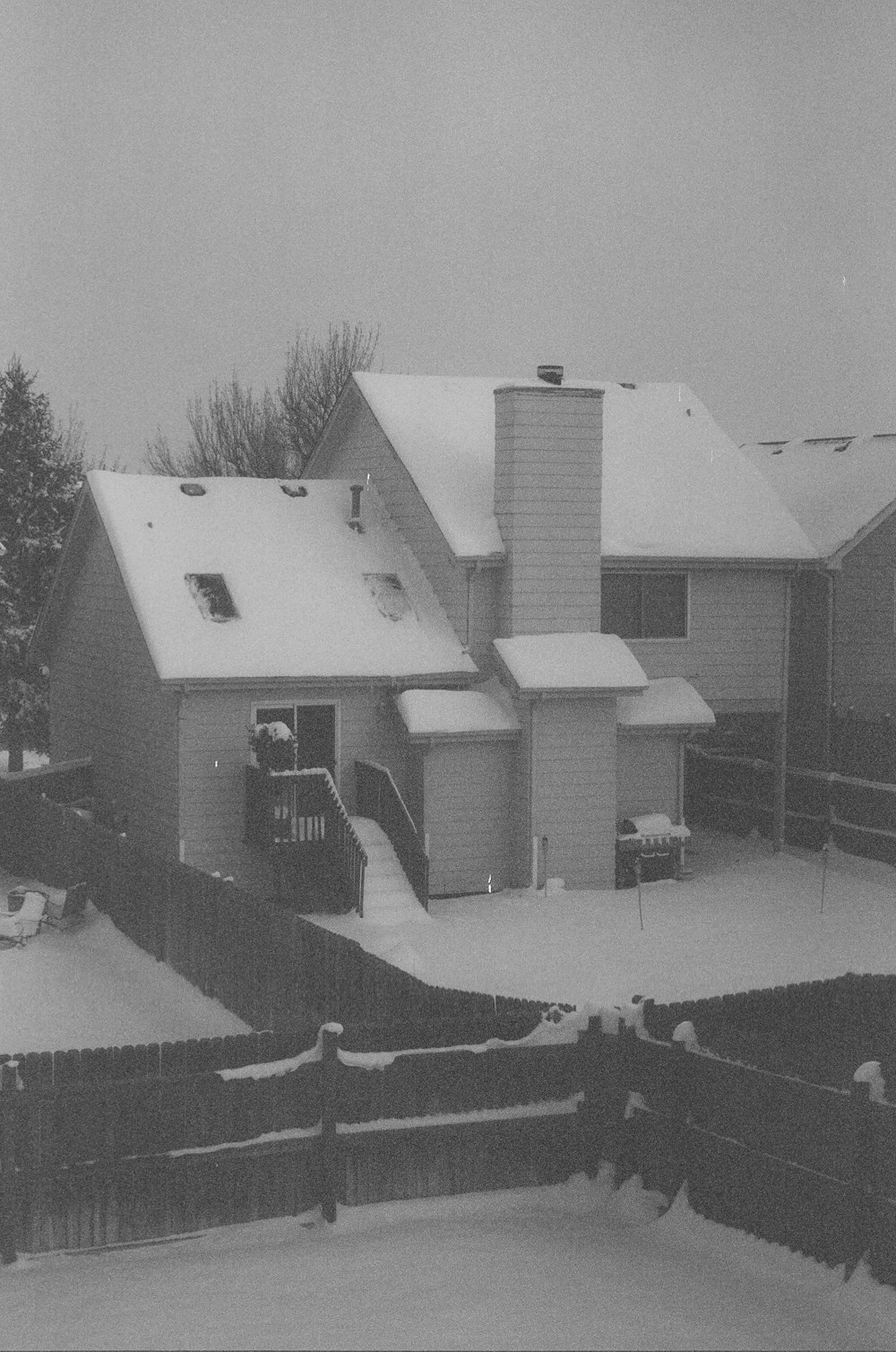 white concrete house near trees during daytime