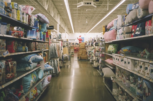 assorted items on white wooden shelf