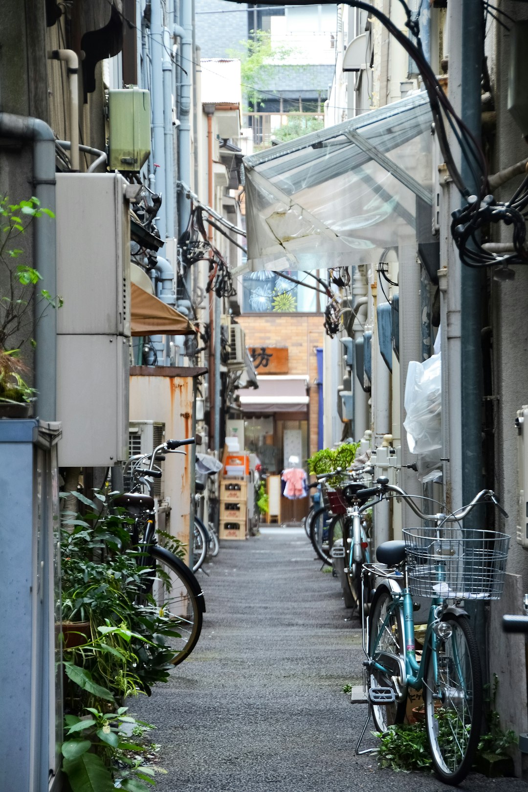 bicycles parked on sidewalk beside building during daytime