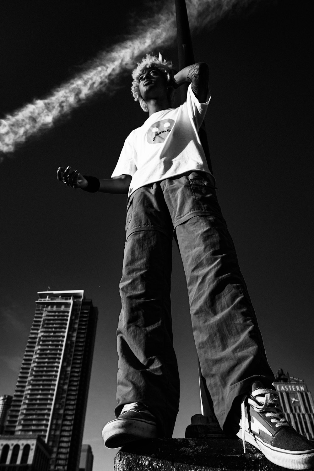 man in white shirt and black denim jeans