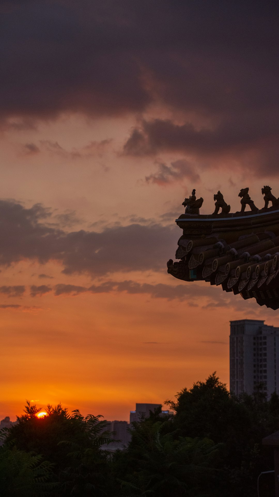 black concrete statue during sunset