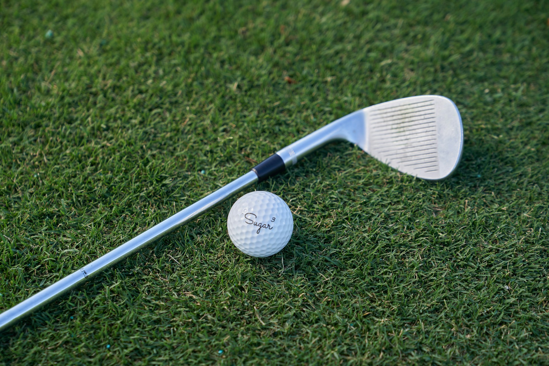 white golf club on green grass field