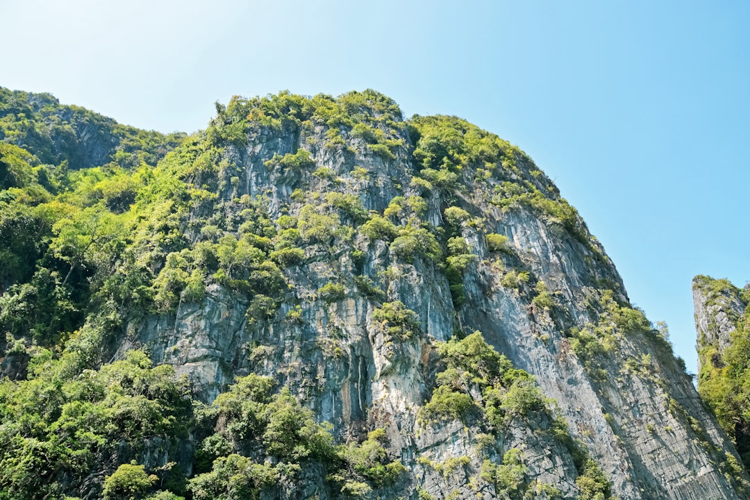 green and gray rock mountain under blue sky during daytime