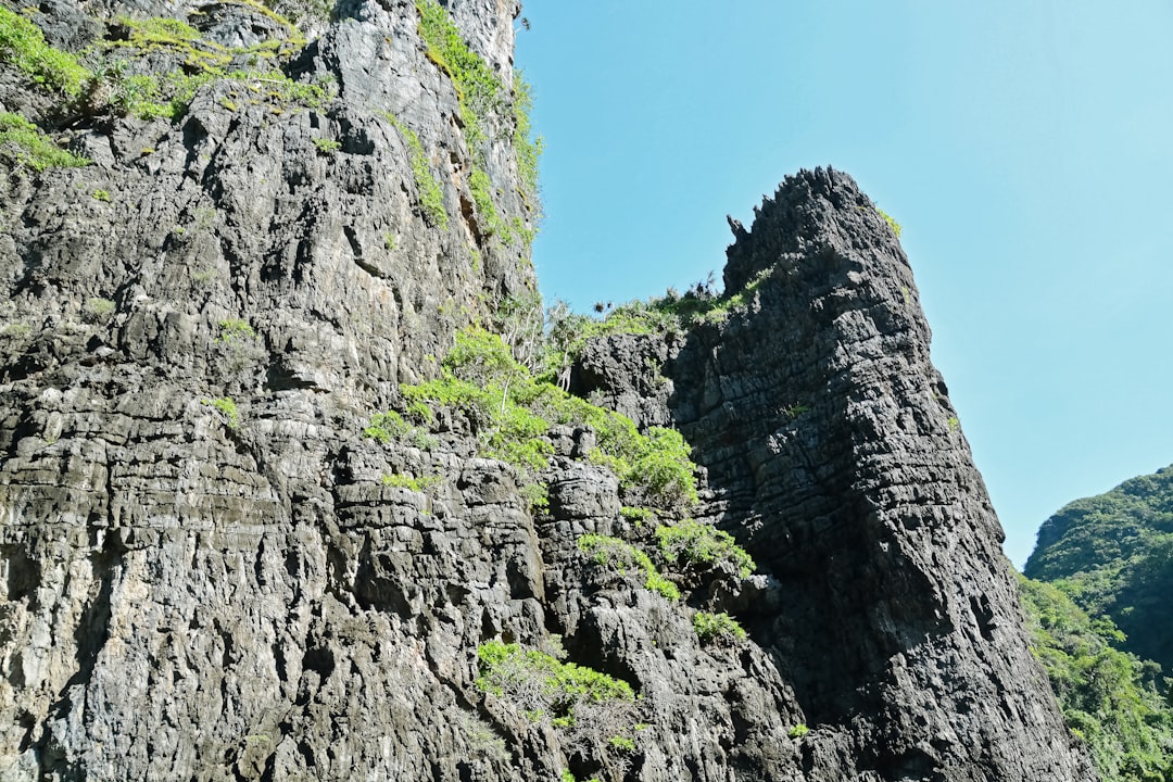 gray rocky mountain under blue sky during daytime