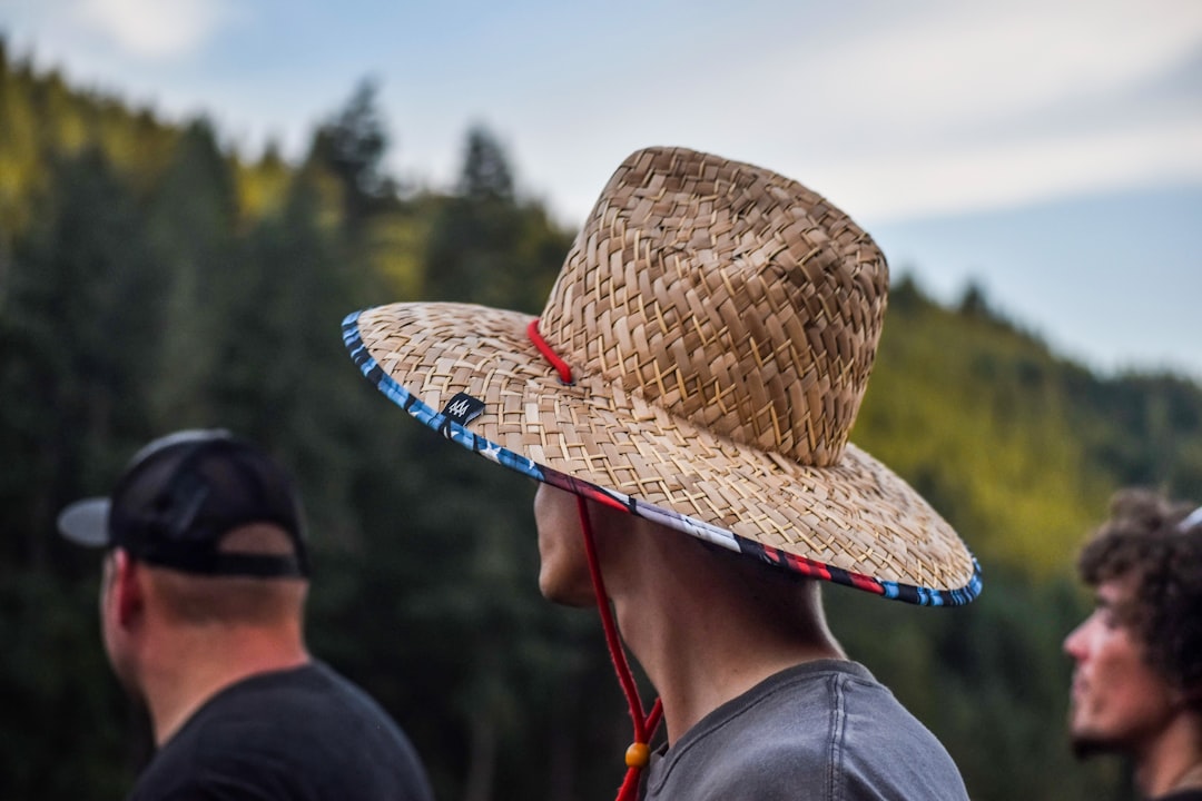 person wearing brown straw hat