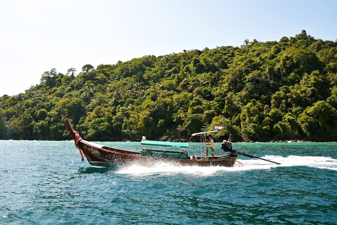 people riding on boat on sea during daytime