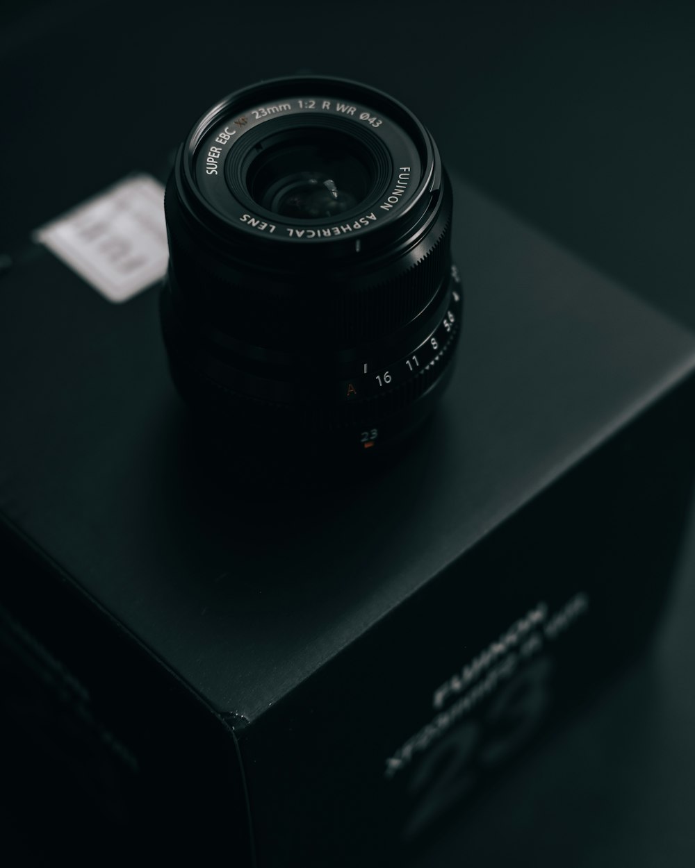 black camera lens on black box
