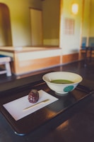 Traditional Japanese tea ceremony in a peaceful setting.