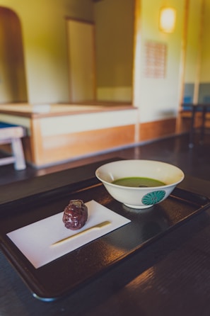 Traditional Japanese tea ceremony in a peaceful setting.