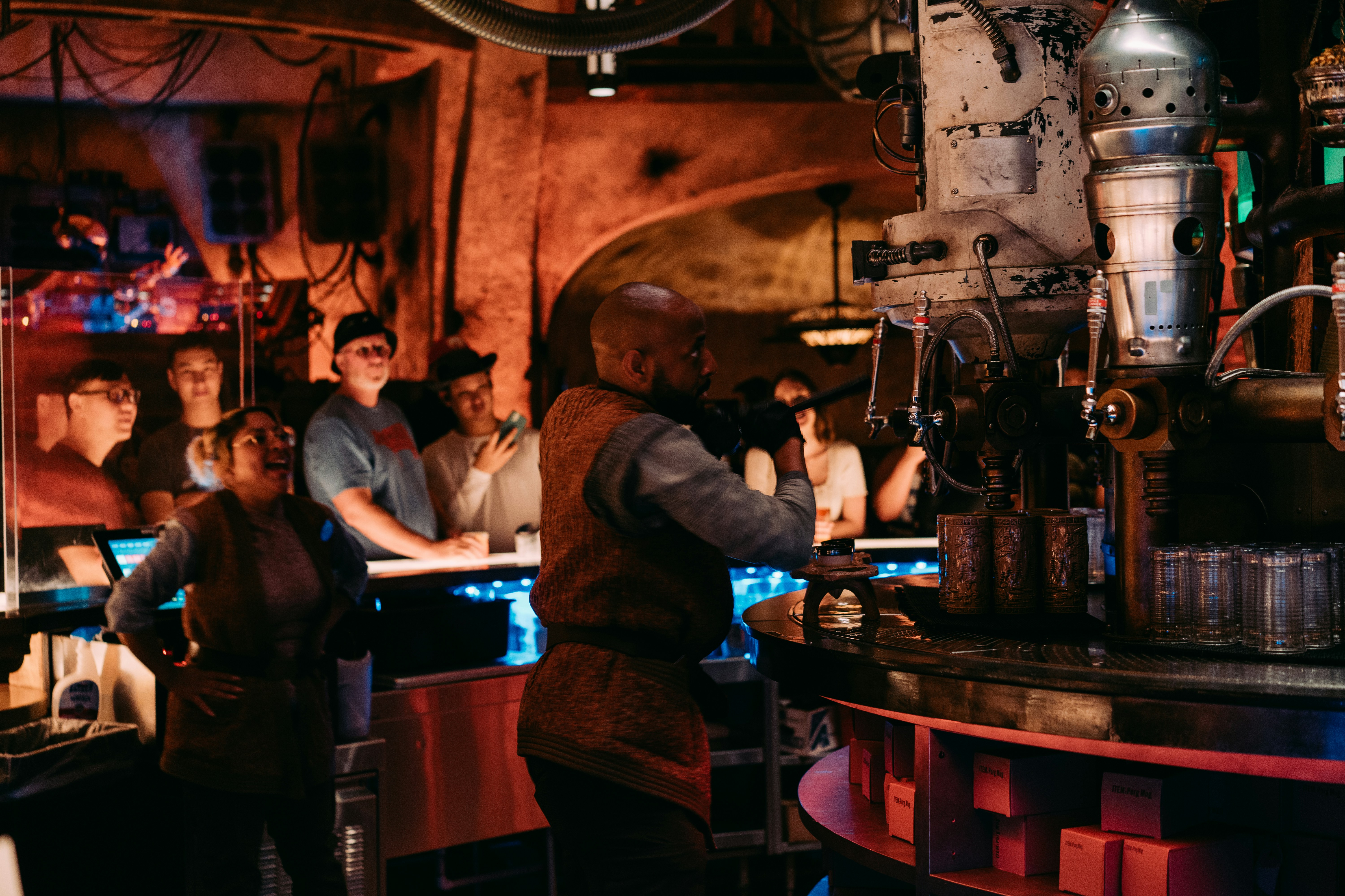 man in blue long sleeve shirt sitting on chair
