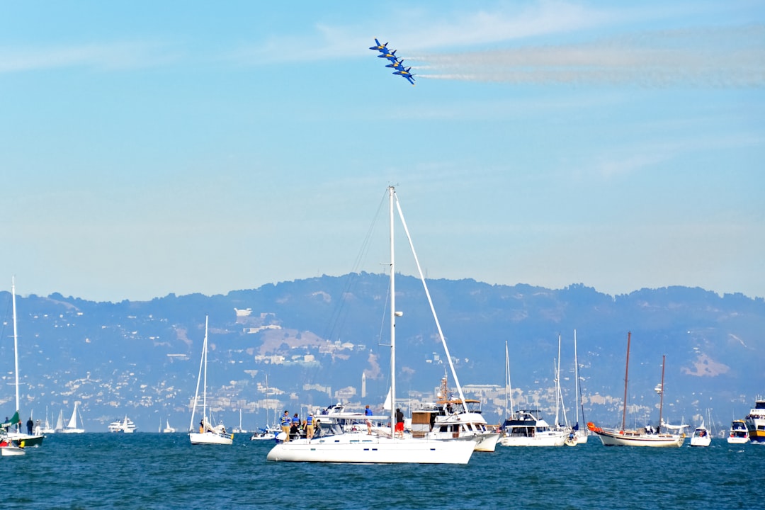 white sail boat on sea during daytime