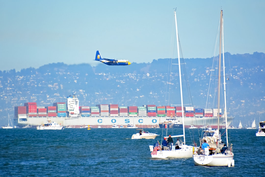 blue and yellow boat on sea during daytime