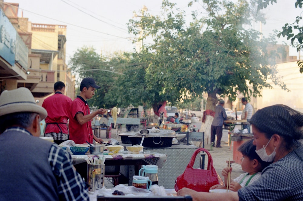 people sitting on chair near table during daytime