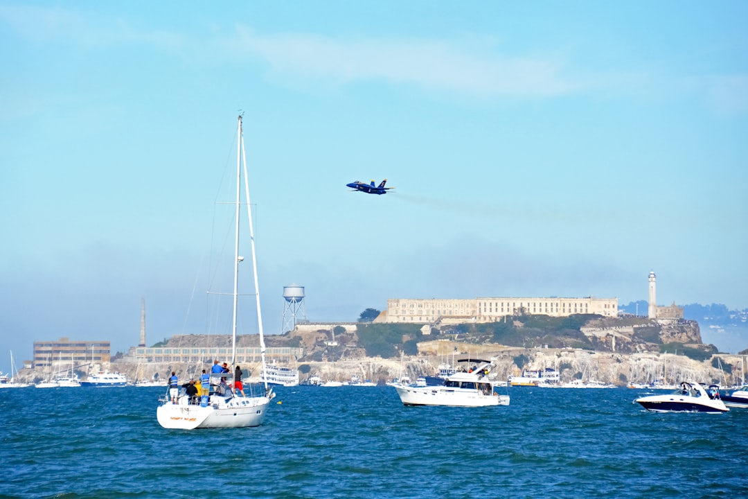 white and blue boat on sea during daytime