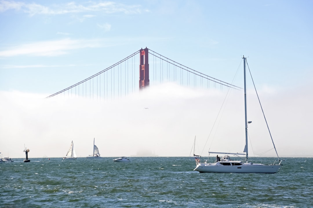 white sailboat on sea near golden gate bridge during daytime