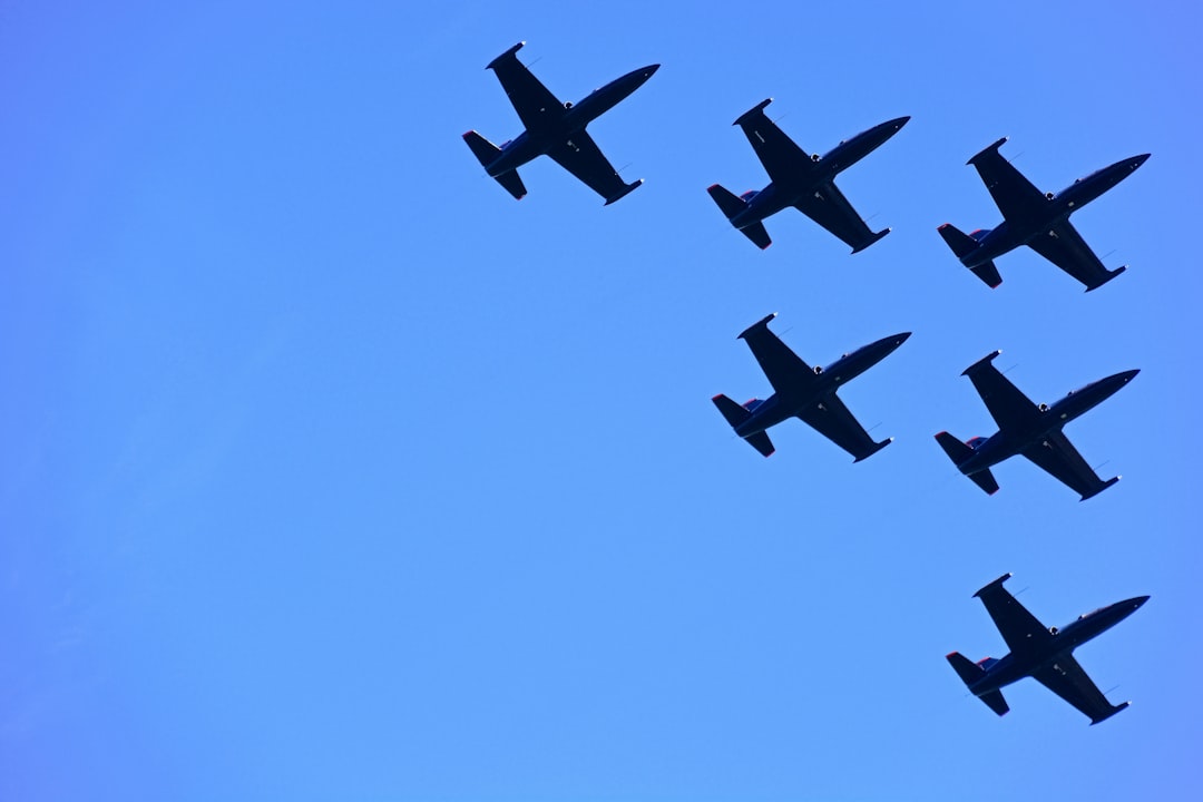 black jet plane in mid air