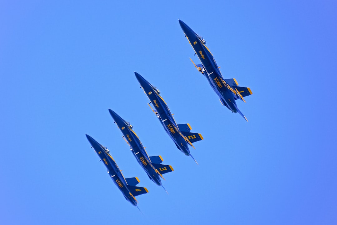 black and yellow jet plane in mid air during daytime