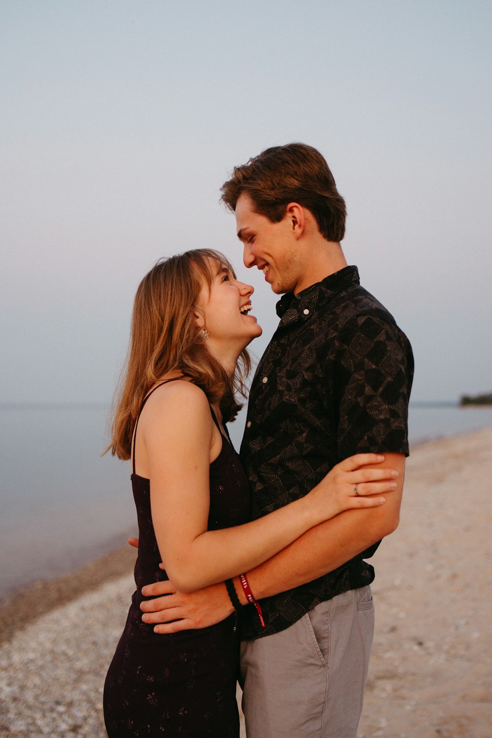 man and woman kissing each other during daytime