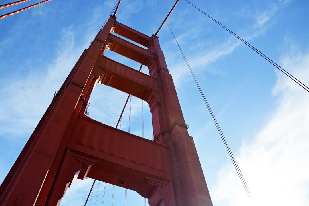 brown metal bridge under blue sky during daytime