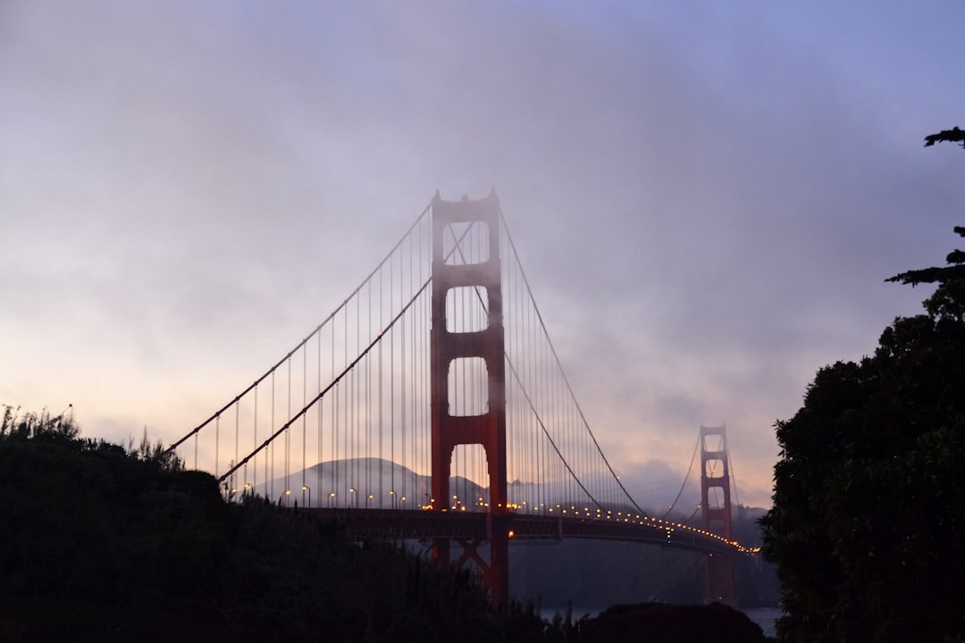 golden gate bridge under cloudy sky