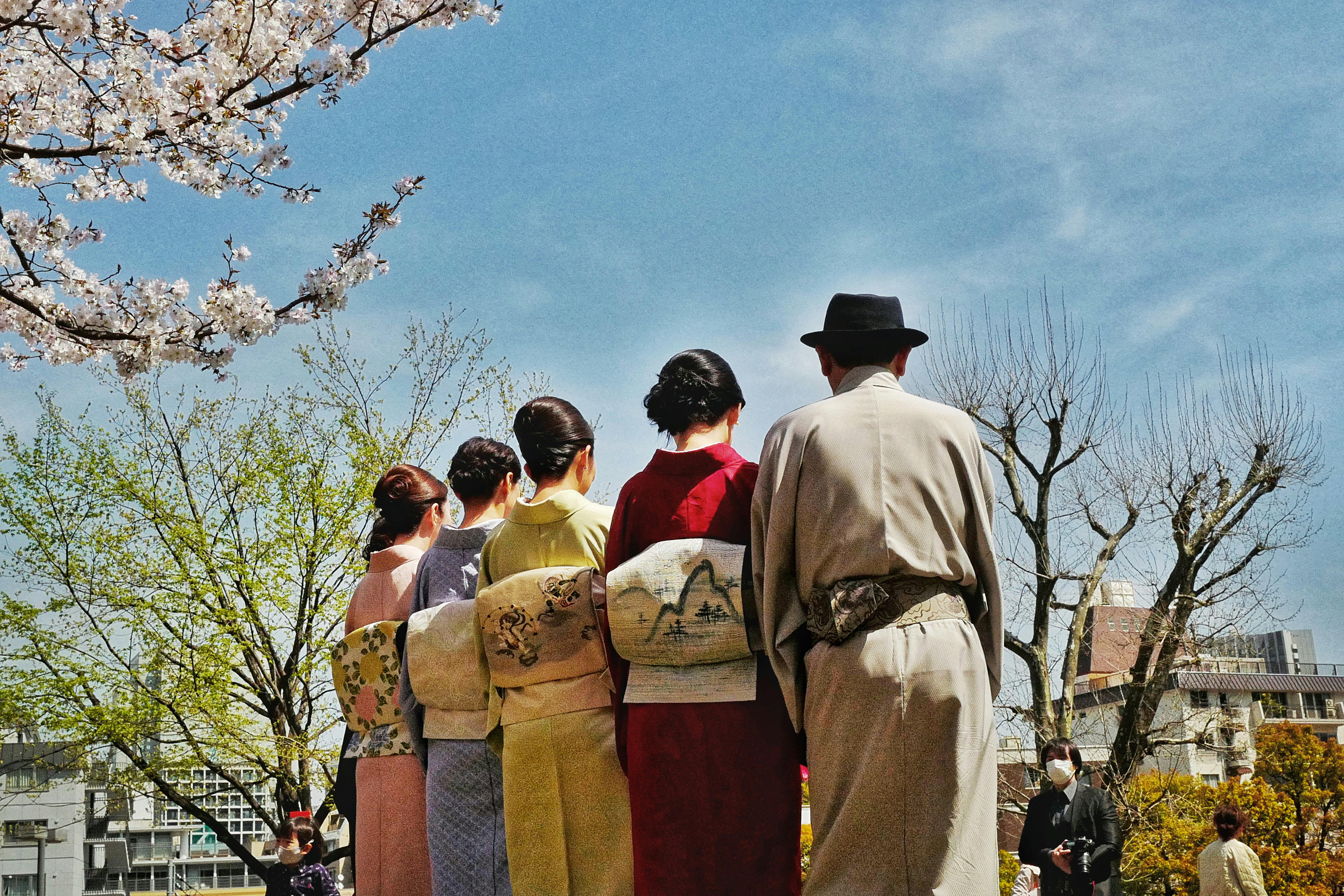 group of people standing on green grass field during daytime
