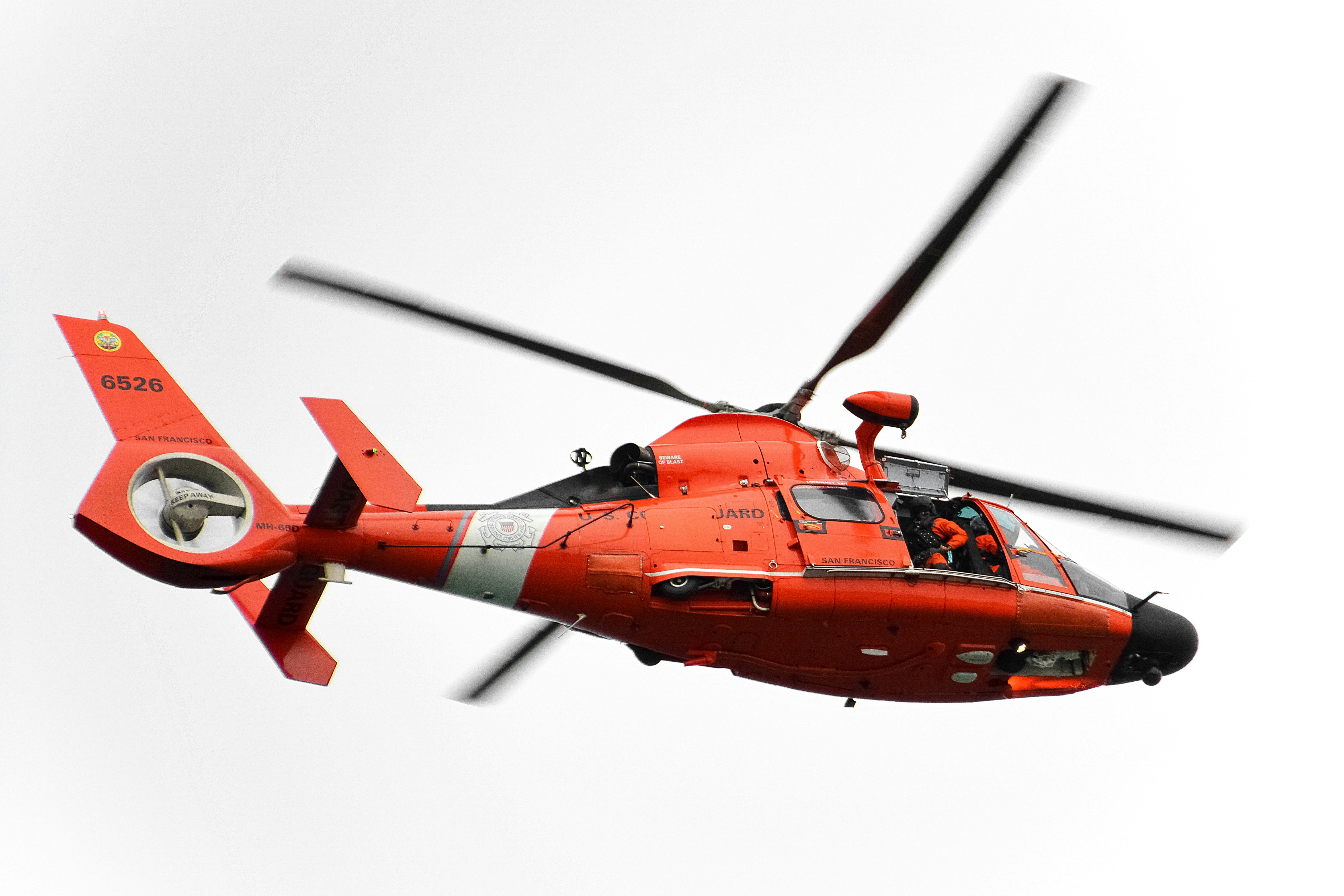 orange and black helicopter in flight