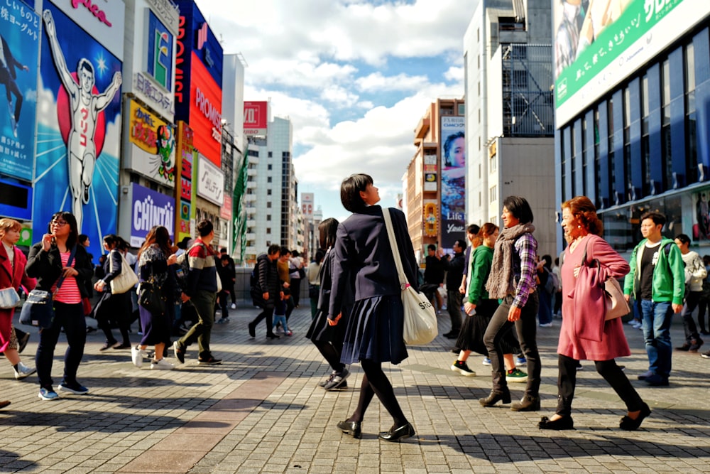 people walking on sidewalk during daytime