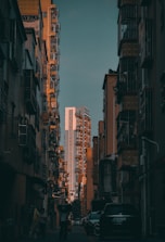 people walking on street between high rise buildings during daytime