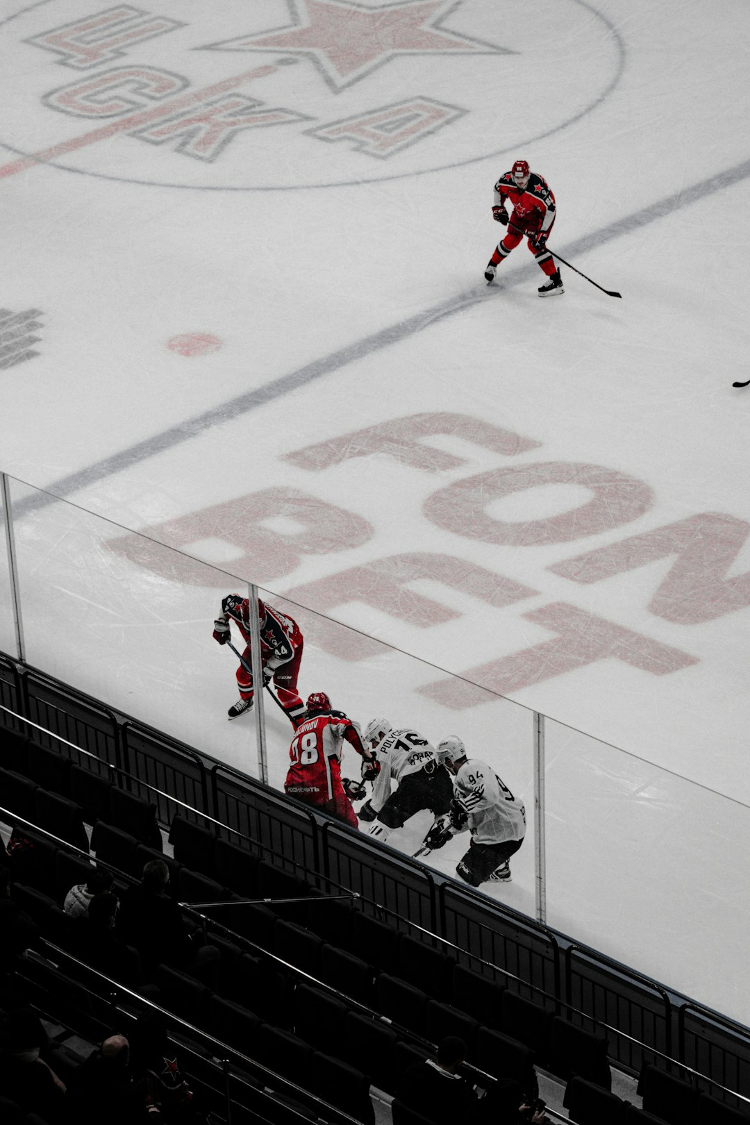 people playing ice hockey on ice field