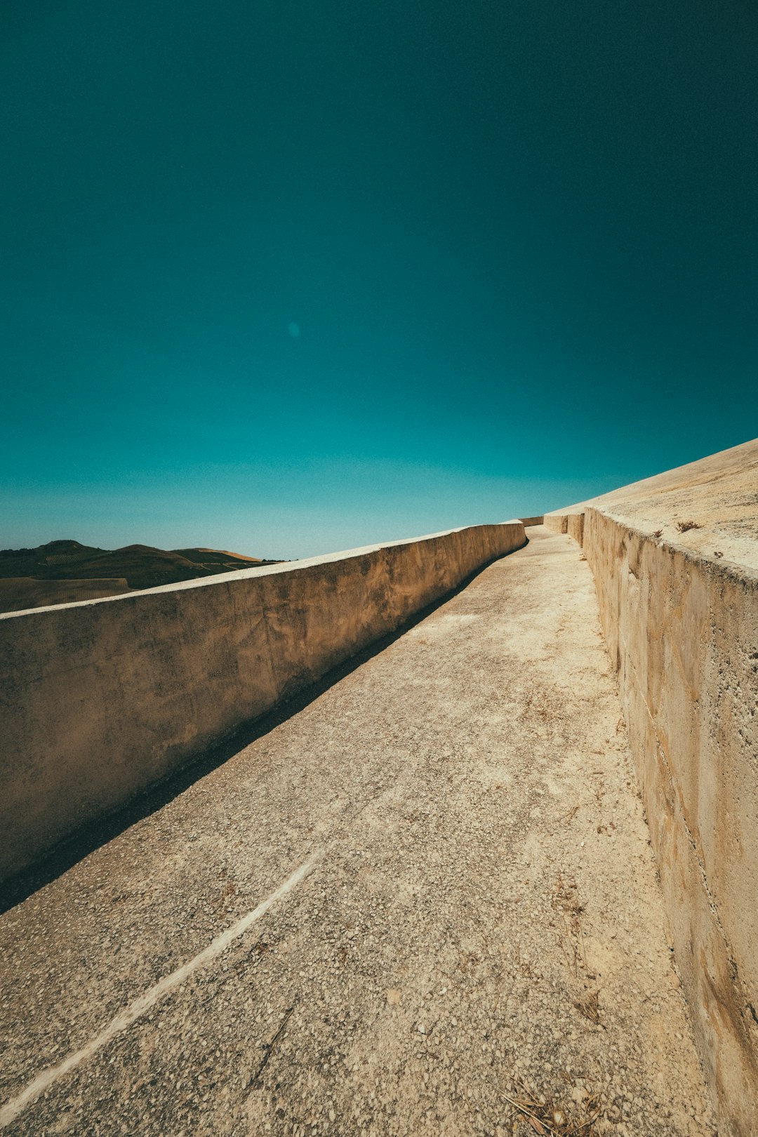 gray concrete wall under blue sky during daytime